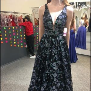 Beautiful beaded dress with sheer sides.